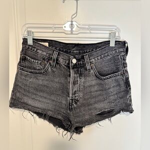 LEVIS 501 Black distressed jean shorts size 26